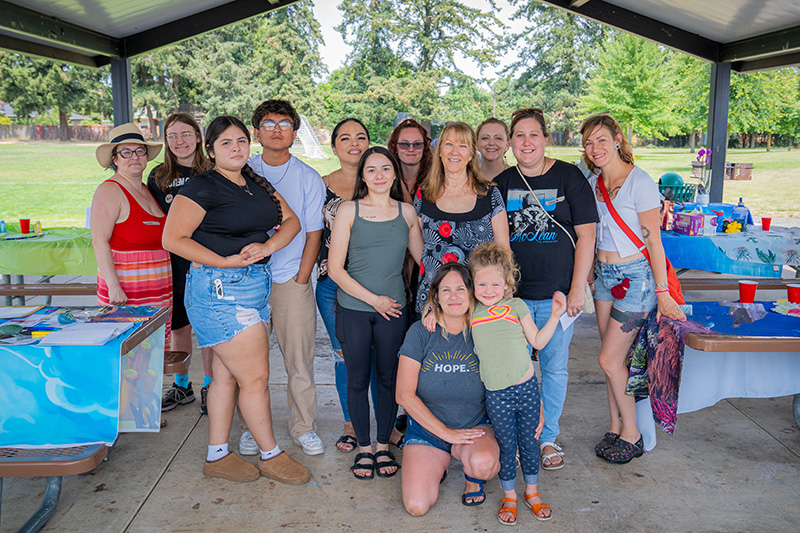 Lucille's Home Director Sharon with former residents and their children at an event